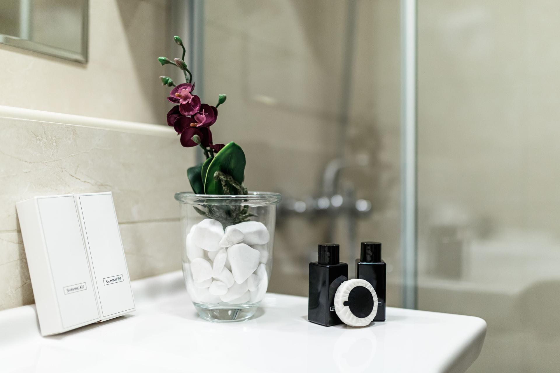 Toiletries: shampoo and shower gel bottles at bathroom